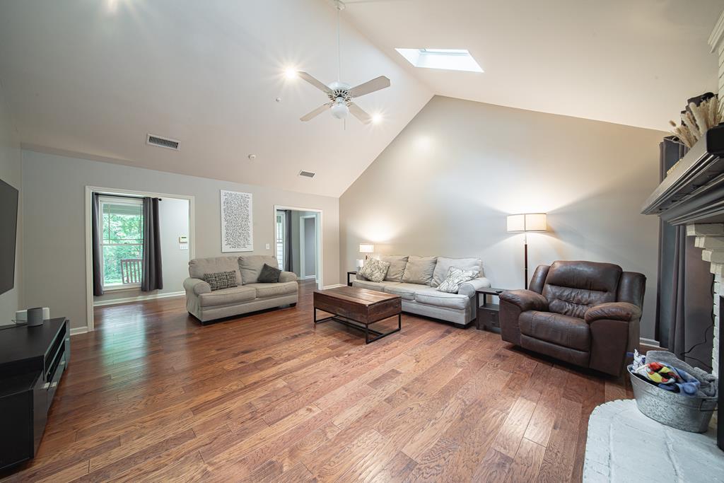 111 Stoneridge Road Cataula, GA 31804 - Photo 23 of 45 a living room with furniture and a wooden floor