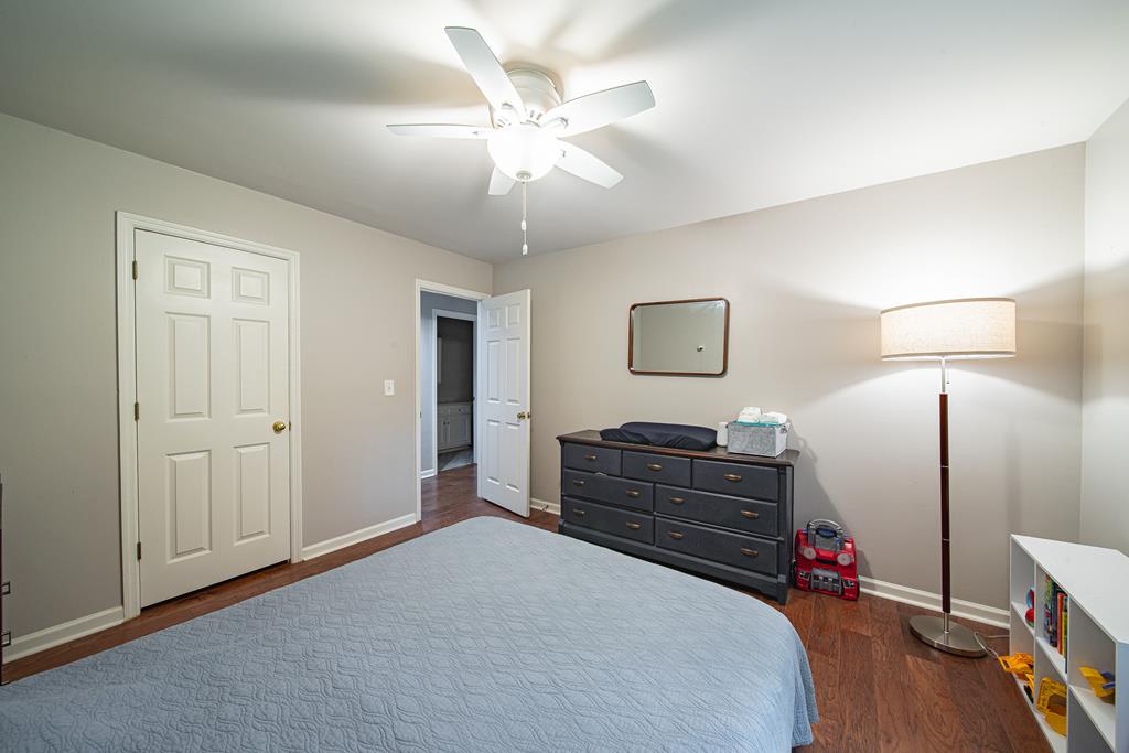 111 Stoneridge Road Cataula, GA 31804 - Photo 26 of 45 a bedroom with a bed and a dresser