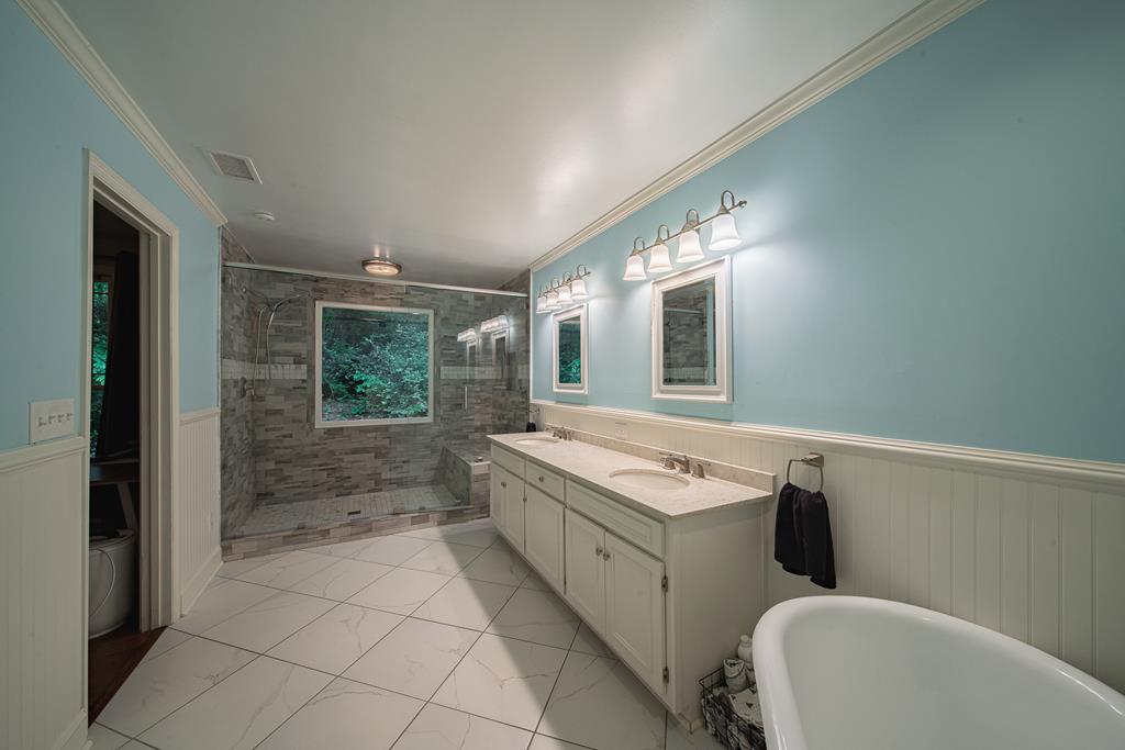 111 Stoneridge Road Cataula, GA 31804 - Photo 30 of 45 a bathroom with a sink and mirror