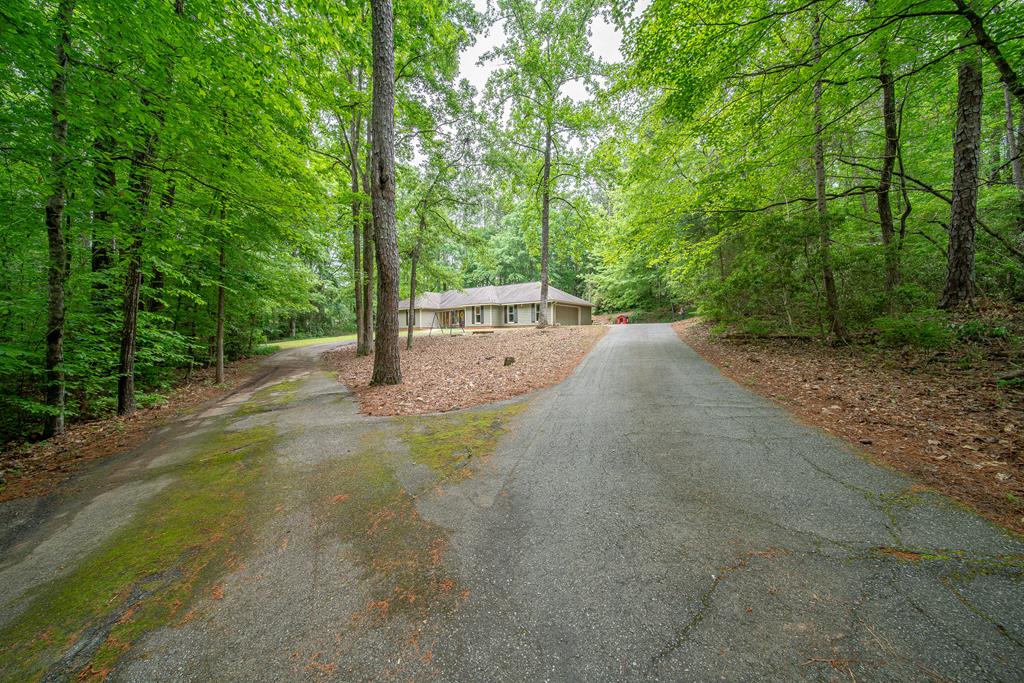 111 Stoneridge Road Cataula, GA 31804 - Photo 3 of 45 a view of a street with a trees