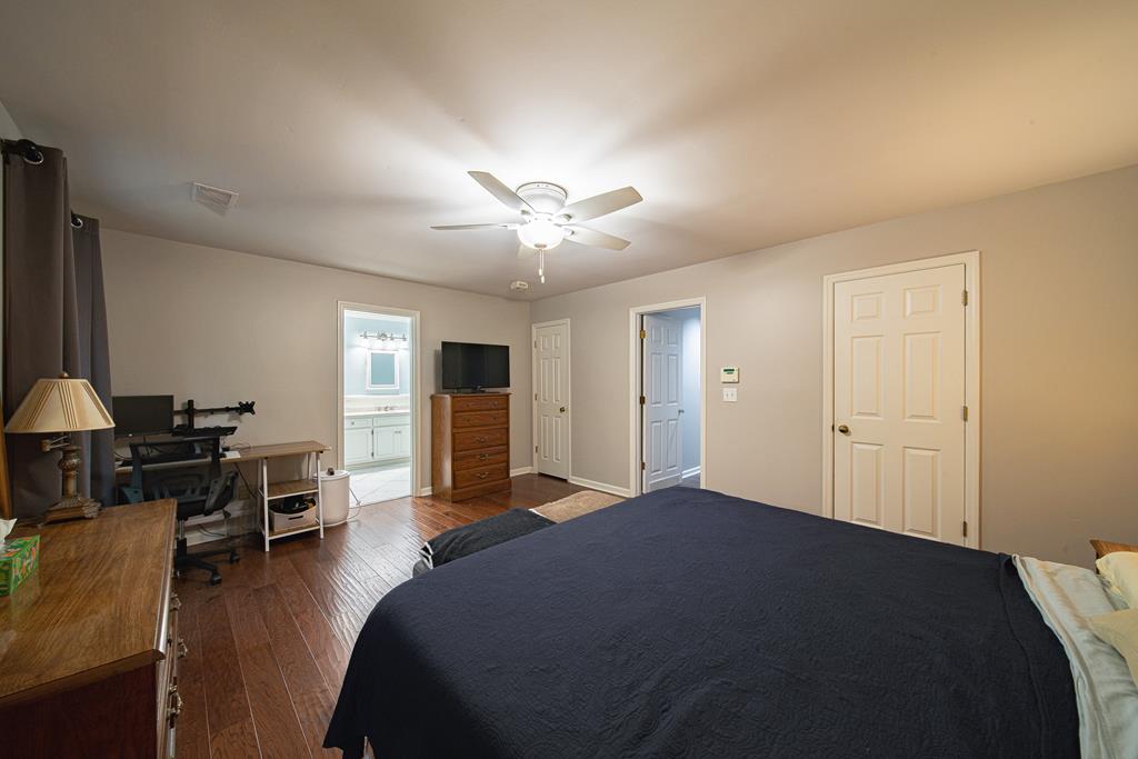 111 Stoneridge Road Cataula, GA 31804 - Photo 39 of 45 a bedroom with a bed and a table in it