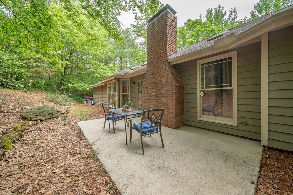 111 Stoneridge Road Cataula, GA 31804 - Photo 43 of 45 a patio with table and chairs and potted plants