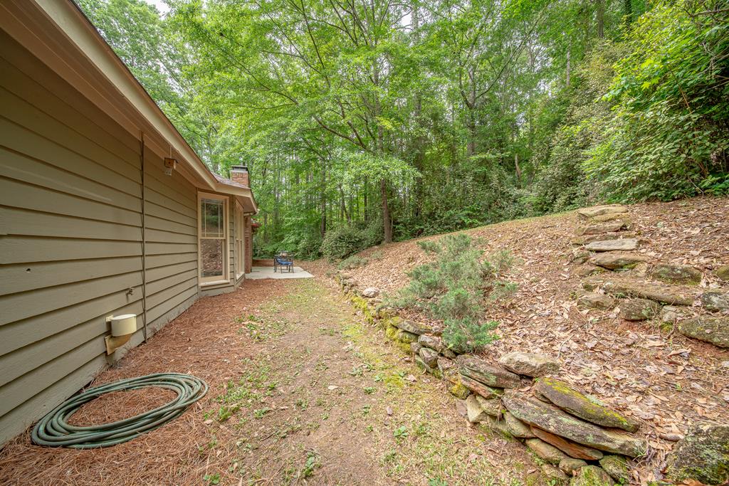 111 Stoneridge Road Cataula, GA 31804 - Photo 45 of 45 a backyard of a house with table and chairs