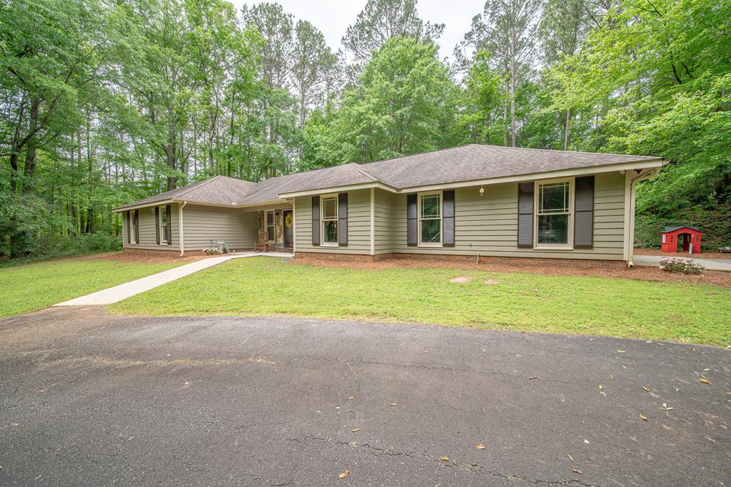 111 Stoneridge Road Cataula, GA 31804 - Photo 5 of 45 a view of a house with a yard and large tree
