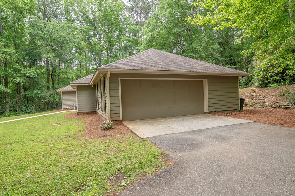111 Stoneridge Road Cataula, GA 31804 - Photo 6 of 45 a front view of a house with yard garage and garage