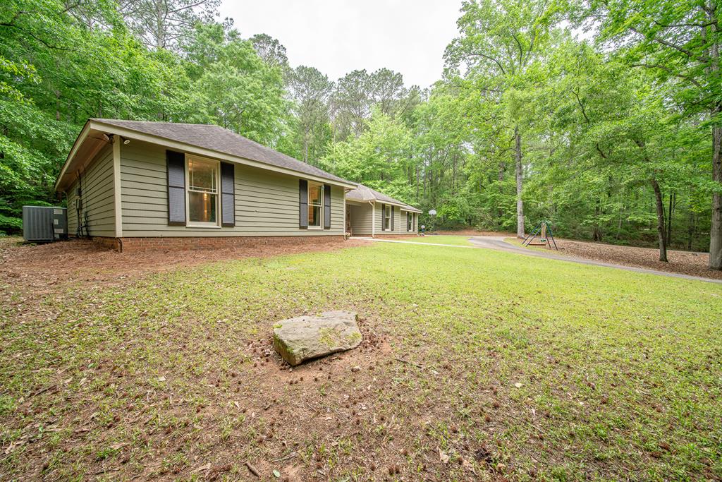 111 Stoneridge Road Cataula, GA 31804 - Photo 8 of 45 a view of a backyard with a garden
