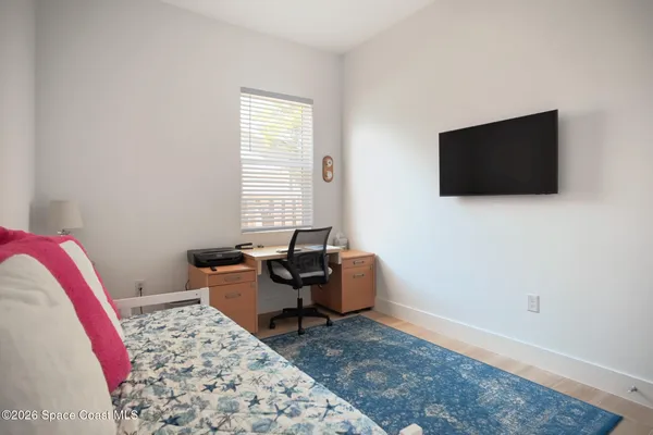 a livingroom with workspace and a window