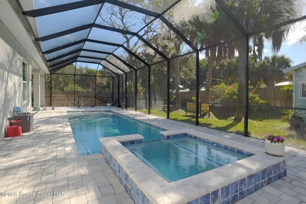 a view of a swimming pool with a patio