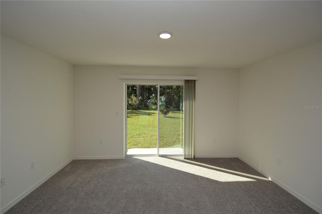 8 Sea Flower Path Palm Coast, FL 32164 - Photo 14 of 30 a view of an empty room with a window
