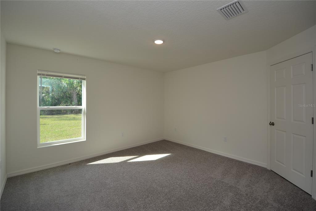 8 Sea Flower Path Palm Coast, FL 32164 - Photo 16 of 30 an empty room with a window