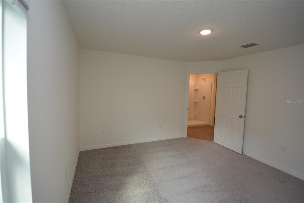 8 Sea Flower Path Palm Coast, FL 32164 - Photo 18 of 30 a view of an empty room