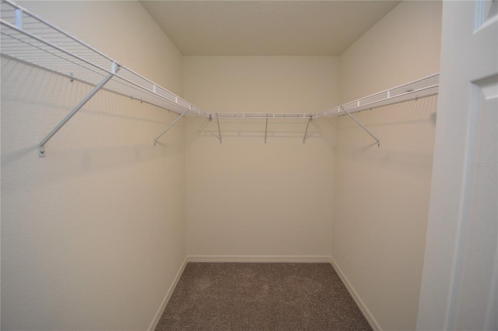 8 Sea Flower Path Palm Coast, FL 32164 - Photo 21 of 30 a view of a room with shelf