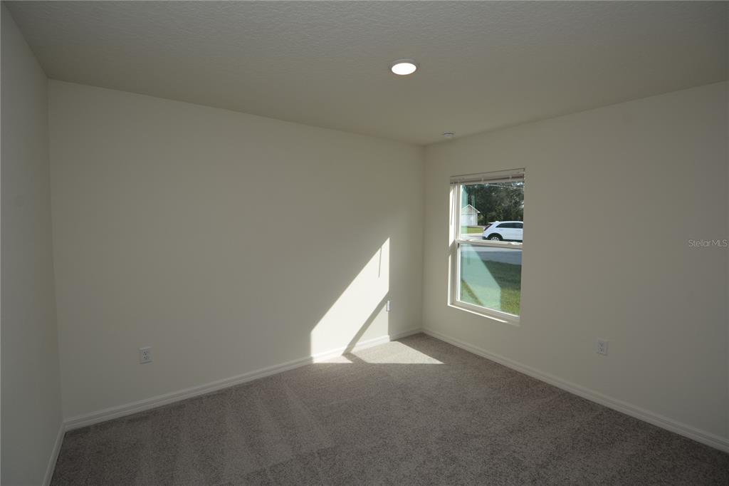 8 Sea Flower Path Palm Coast, FL 32164 - Photo 25 of 30 an empty room with windows