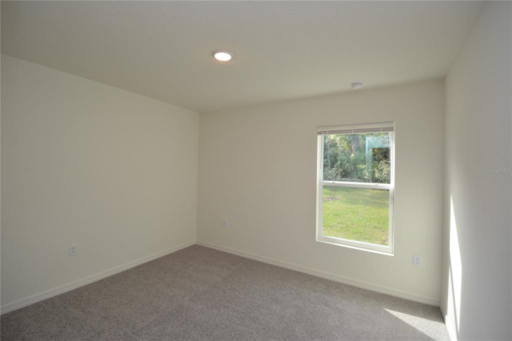 8 Sea Flower Path Palm Coast, FL 32164 - Photo 28 of 30 an empty room with a window