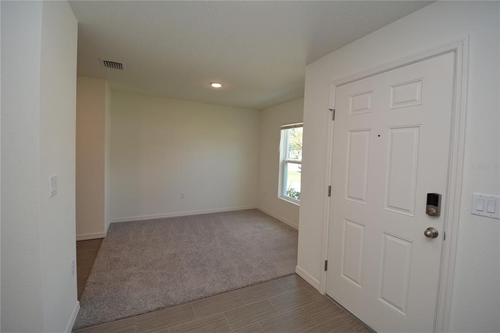 8 Sea Flower Path Palm Coast, FL 32164 - Photo 3 of 30 a view of an empty room and window