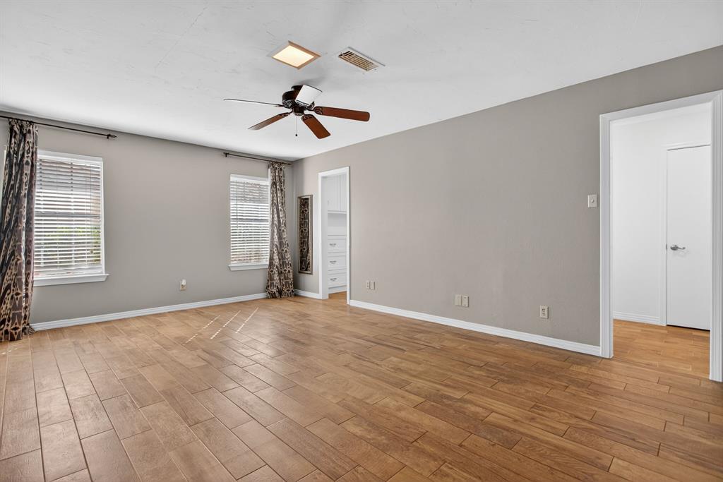 7117 Serrano Drive Benbrook, TX 76126 - Photo 15 of 26 Spare room with ceiling fan and light wood-style floors