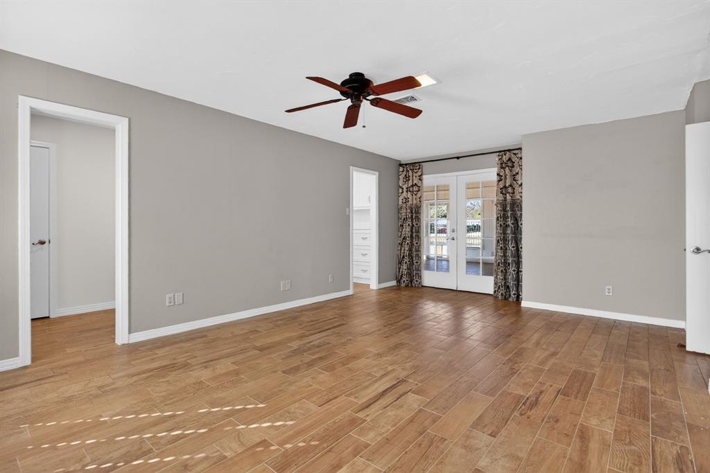 7117 Serrano Drive Benbrook, TX 76126 - Photo 16 of 26 Unfurnished room with french doors, a ceiling fan, and light wood finished floors