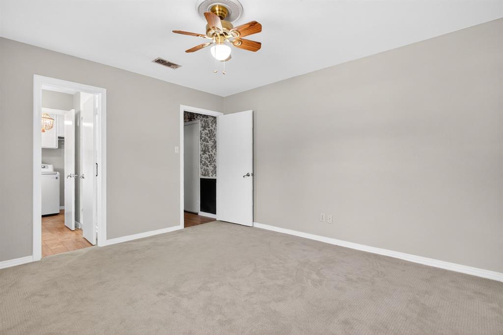 7117 Serrano Drive Benbrook, TX 76126 - Photo 21 of 26 Unfurnished bedroom featuring carpet floors, a ceiling fan, and washer / clothes dryer