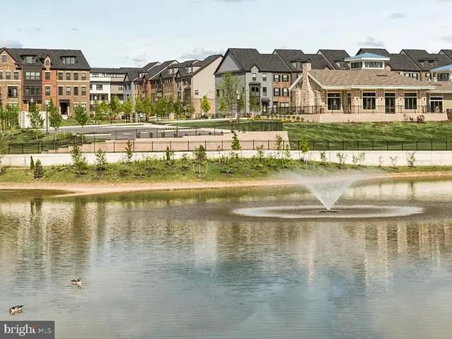 an outdoor space with pool and furniture