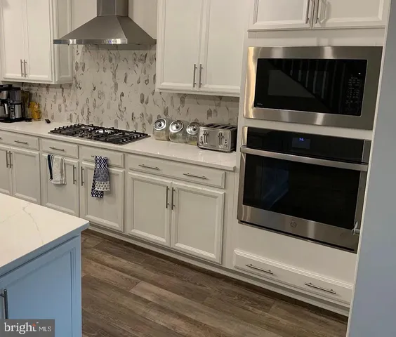 a dining room with table and chairs