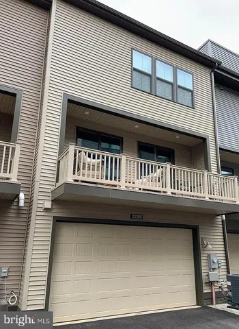 a roof deck with furniture and window