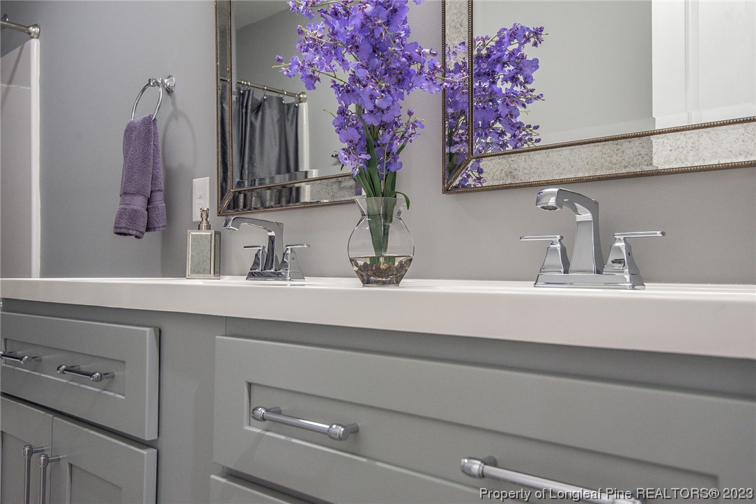 341 Solomon Drive Cameron, NC 28326 - Photo 17 of 21 a bathroom with a sink and mirror