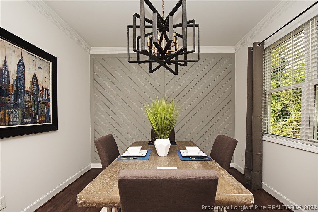 341 Solomon Drive Cameron, NC 28326 - Photo 6 of 21 a view of a dining room with furniture and wooden floor