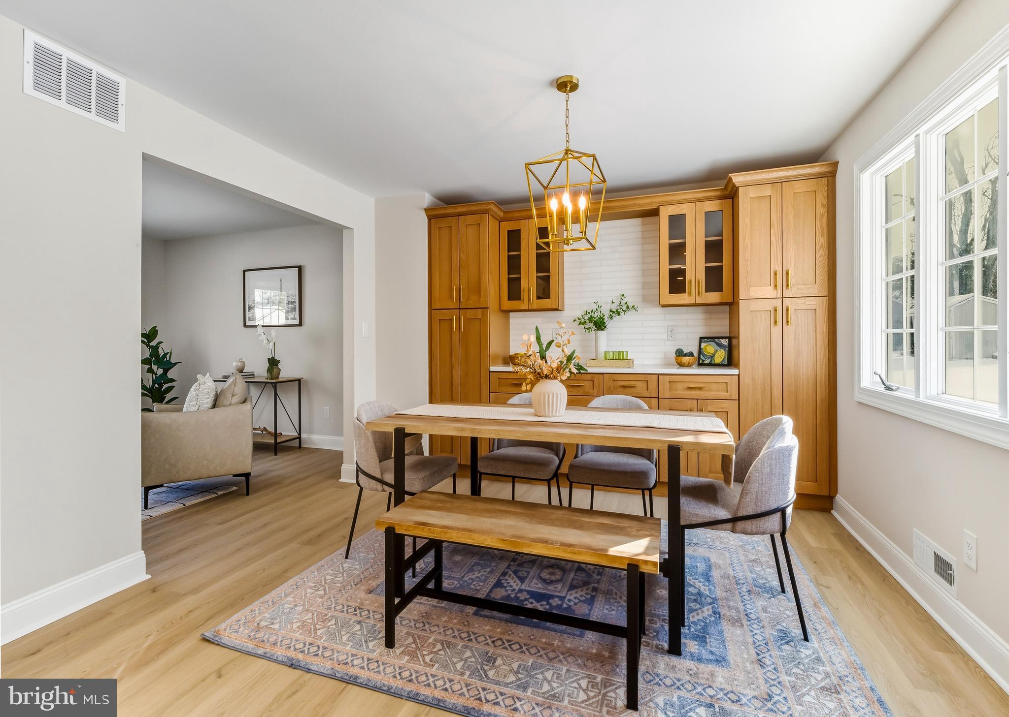 33 Elmgate Road Marlton, NJ 08053 - Photo 16 of 29 a dining room with furniture a rug and wooden floor