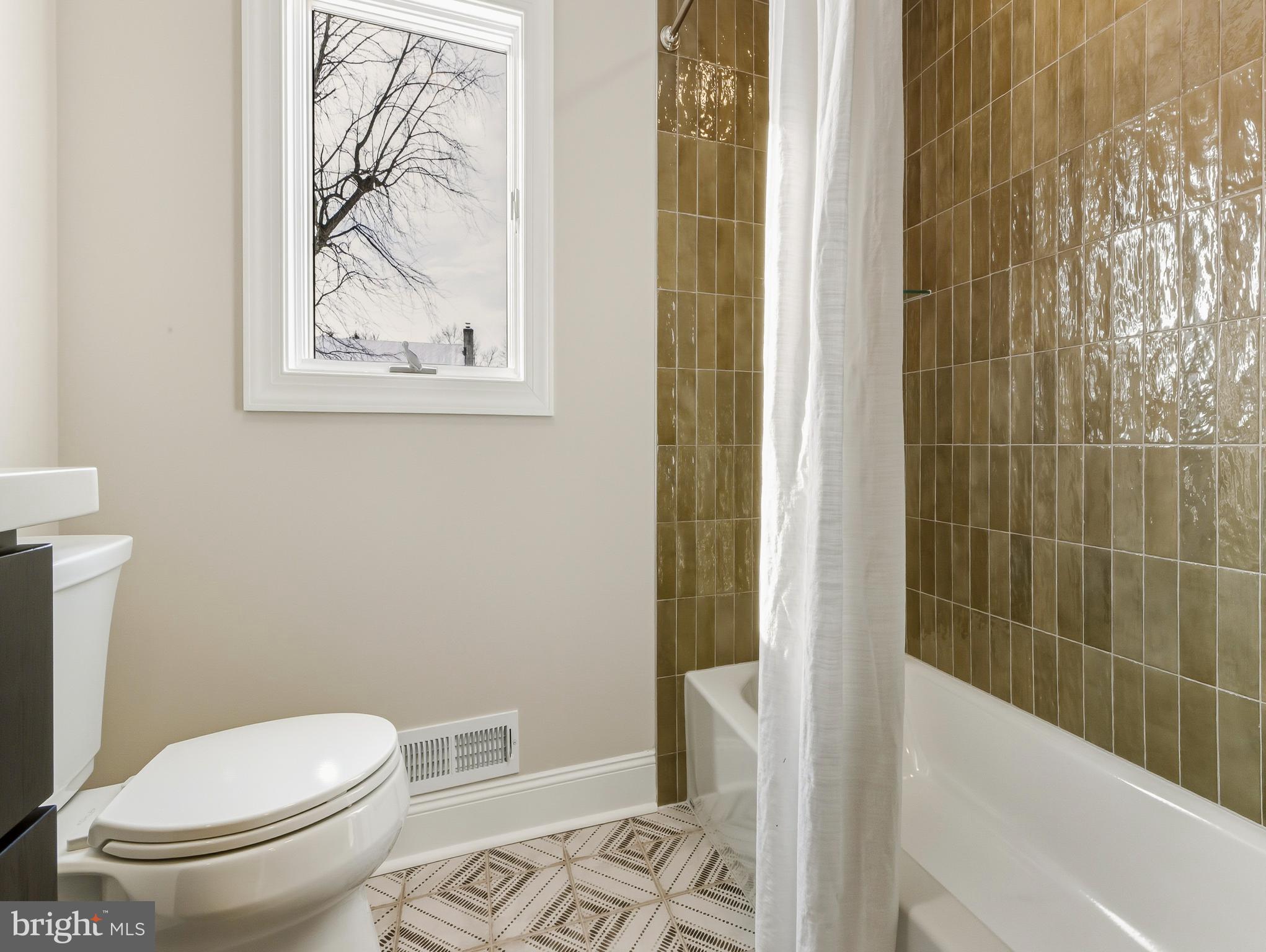 33 Elmgate Road Marlton, NJ 08053 - Photo 22 of 29 a white toilet sitting next to a bath tub