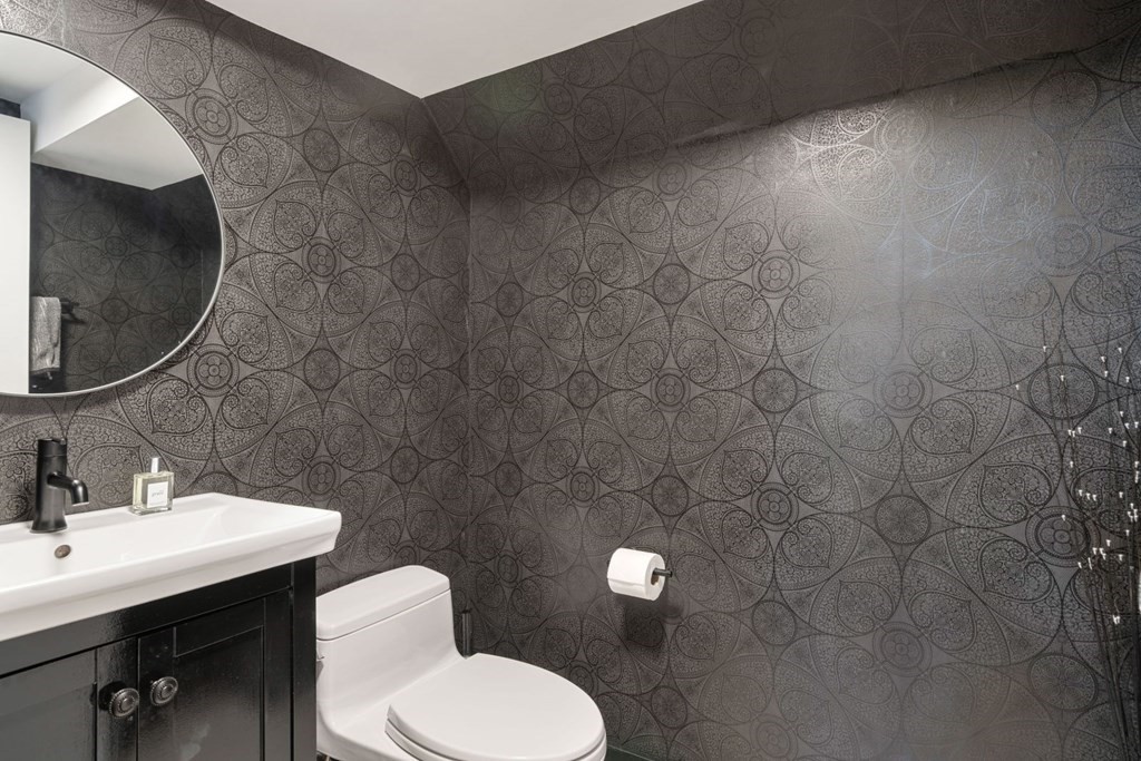 112 West 3rd Street Boston, MA 02127 - Photo 12 of 33 a bathroom with a toilet sink and mirror