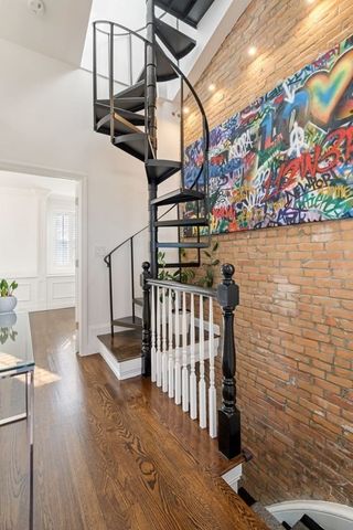 a view of entryway with wooden floor