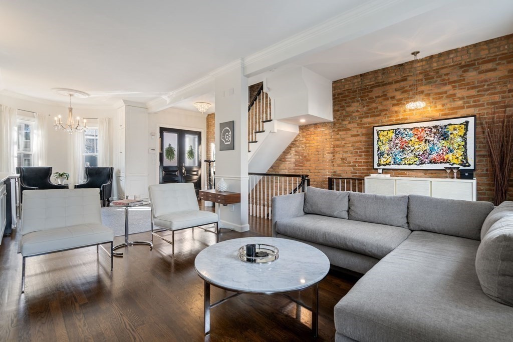 112 West 3rd Street Boston, MA 02127 - Photo 2 of 33 a living room with furniture and a dining table with wooden floor