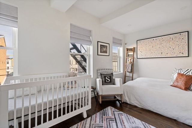 a bedroom with furniture and a window