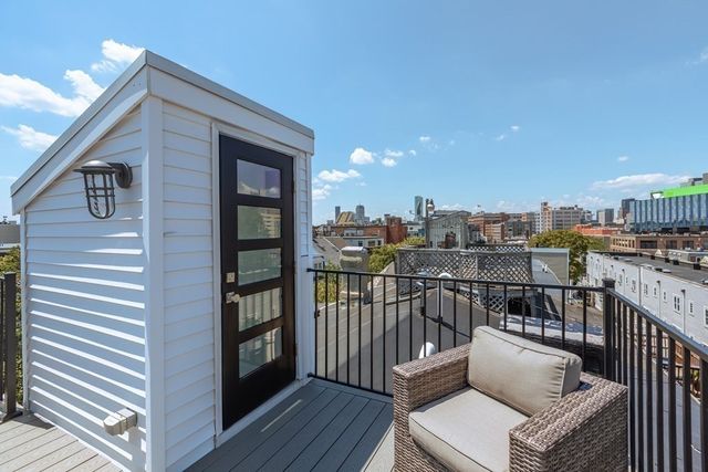 a view of a balcony with furniture