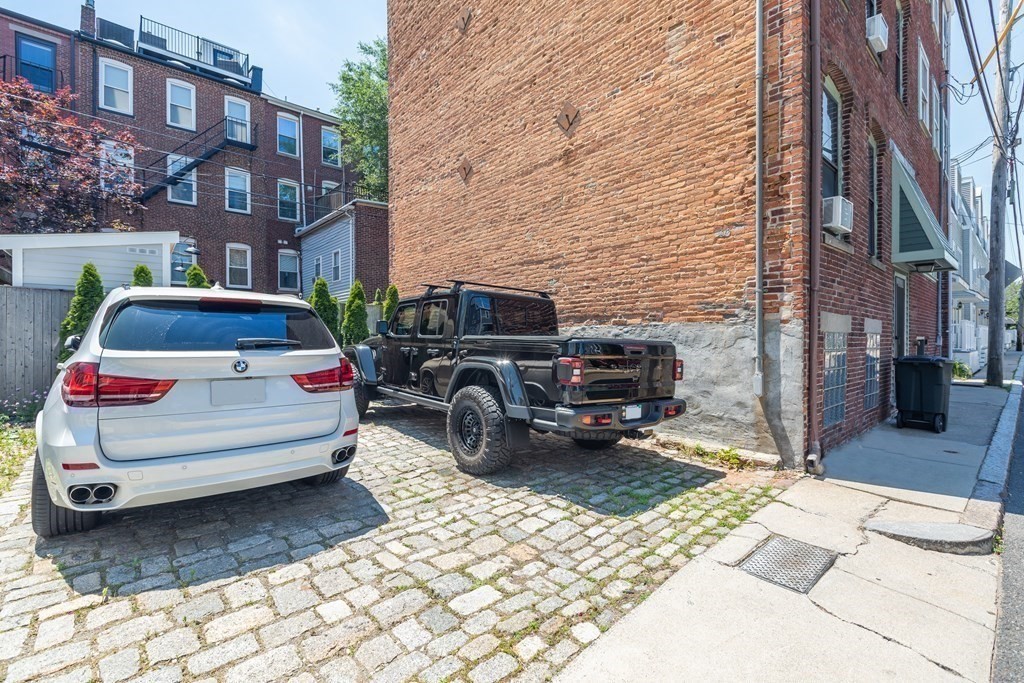 112 West 3rd Street Boston, MA 02127 - Photo 33 of 33 a car parked in front of a brick building