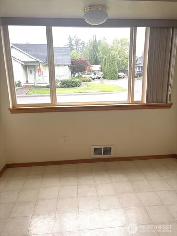 a view of a room that has a window in it