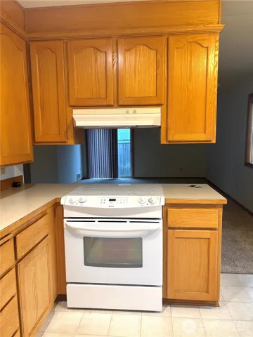 a kitchen with a stove and a sink