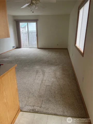 a view of an empty room with a window