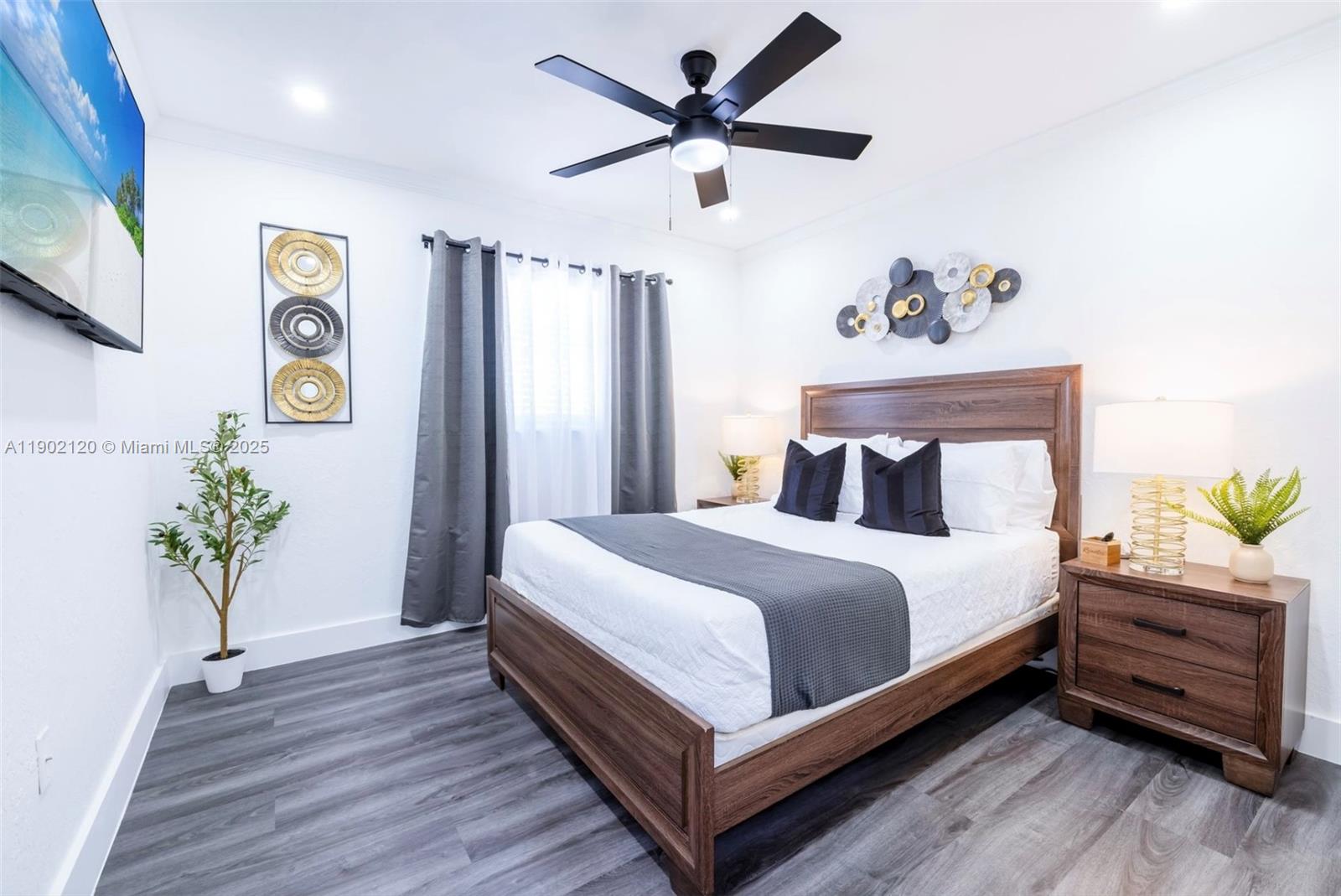 15445 Southwest 57th Street Miami, FL 33193 - Photo 17 of 32 a bedroom with a bed and a potted plant