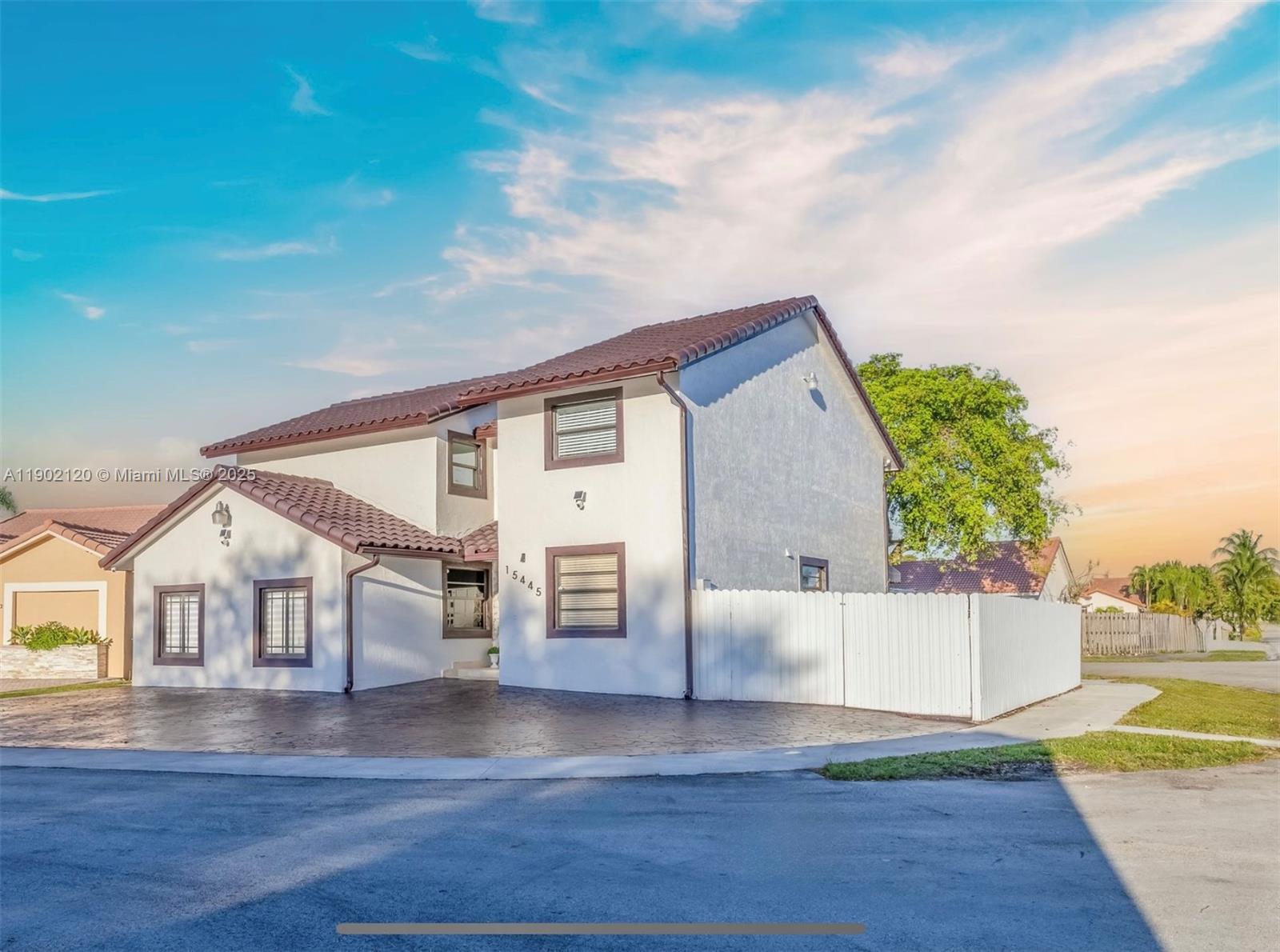 15445 Southwest 57th Street Miami, FL 33193 - Photo 2 of 32 a view of house with yard and sitting area