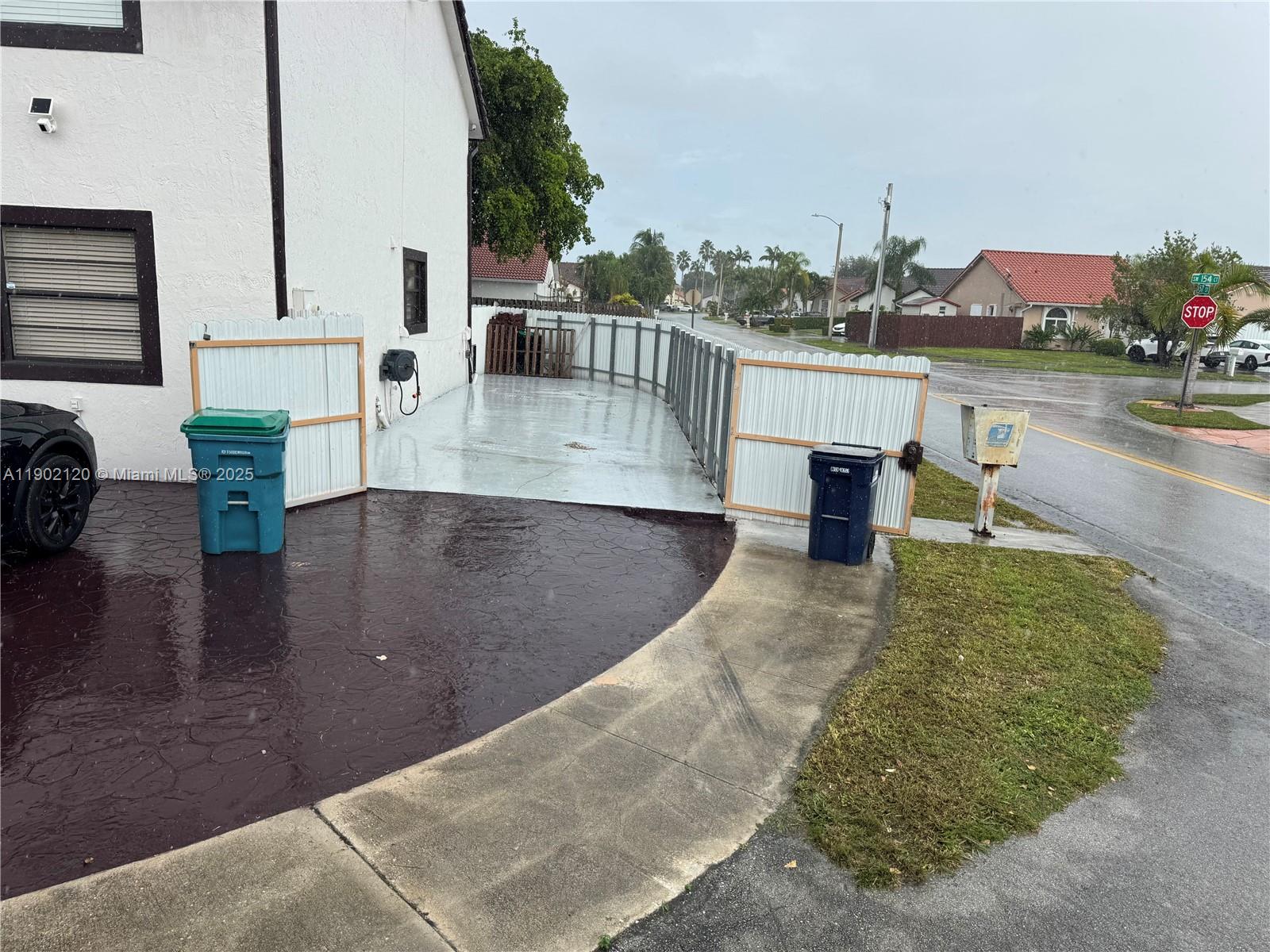 15445 Southwest 57th Street Miami, FL 33193 - Photo 32 of 32 a view of a swimming pool with outdoor seating and plants