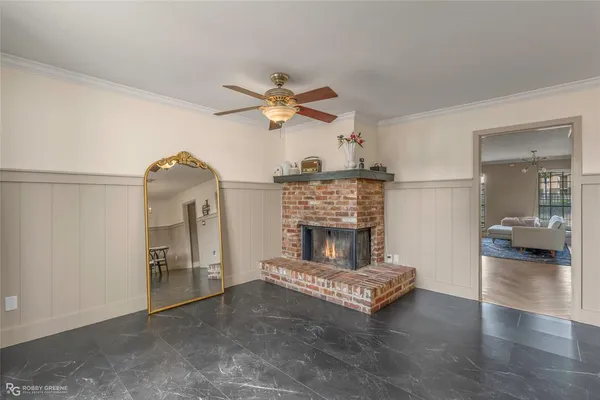 a view of a livingroom with furniture and a kitchen