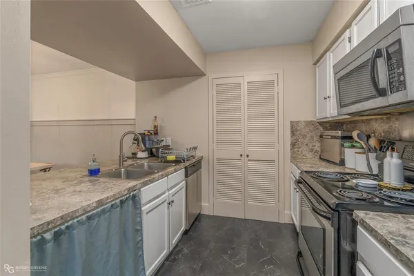 a bathroom with a sink a vanity and a mirror
