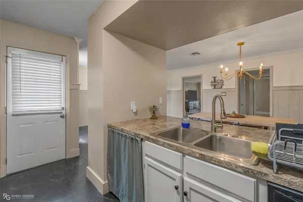 a kitchen with stainless steel appliances granite countertop a stove and a refrigerator
