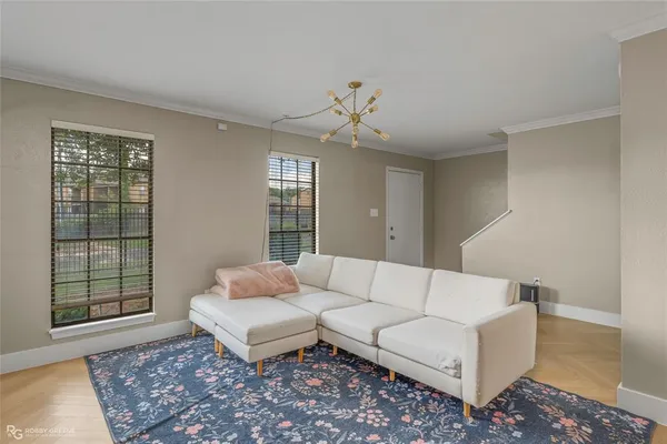 a living room with furniture and rug