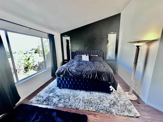 a living room with a couch rug and a table