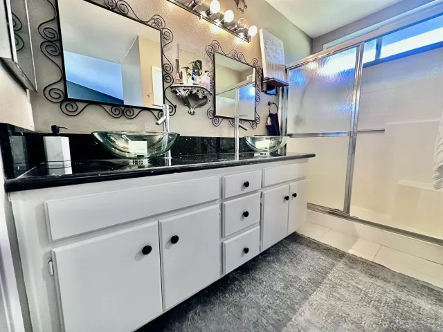 a kitchen with cabinets a sink and appliances