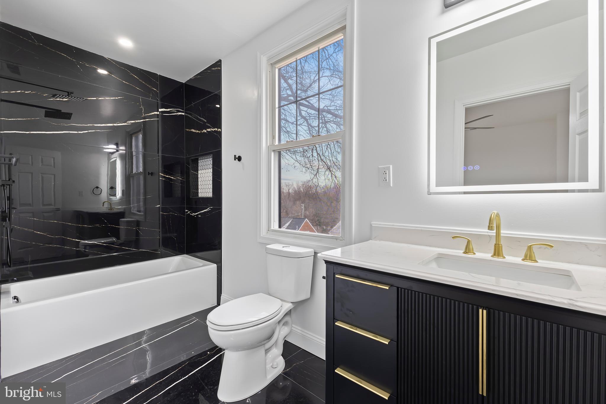 2016 32nd Street Southeast Washington, DC 20020 - Photo 16 of 25 Ensuite Bathroom with LED Mirror