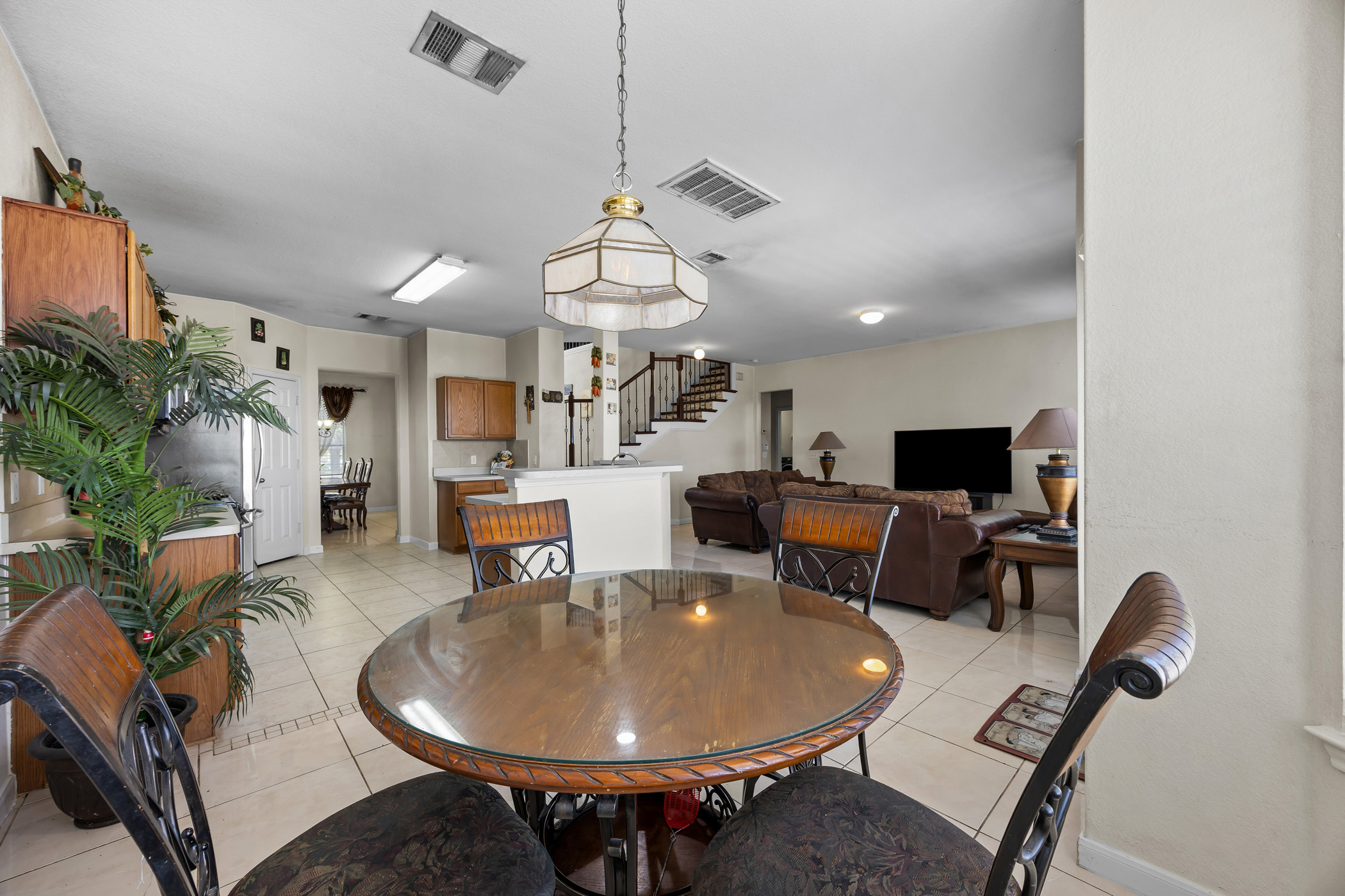 3502 Shiraz Loop Round Rock, TX 78665 - Photo 5 of 23 a living room with furniture a dining table and a potted plant