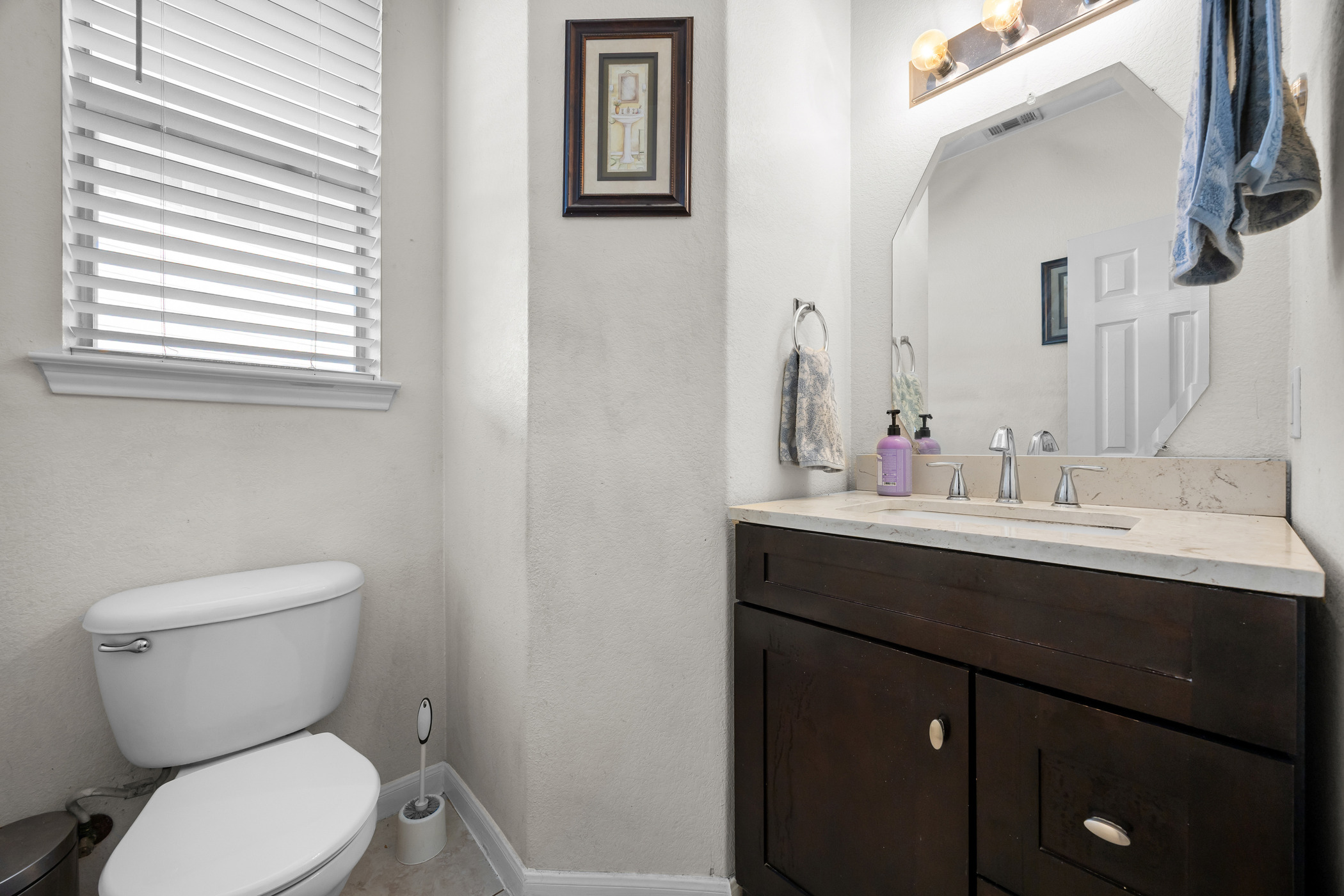 3502 Shiraz Loop Round Rock, TX 78665 - Photo 10 of 23 a bathroom with a toilet a sink and mirror